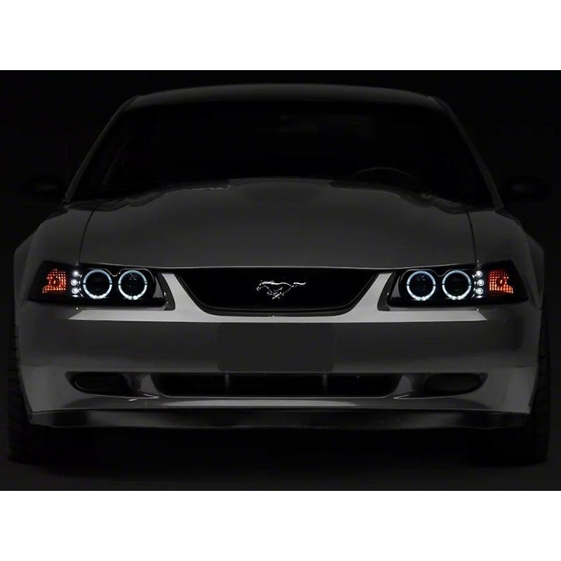 Raxiom 99-04 Ford Mustang Dual LED Halo Projector Headlights- Black Housing | Smoked Lens